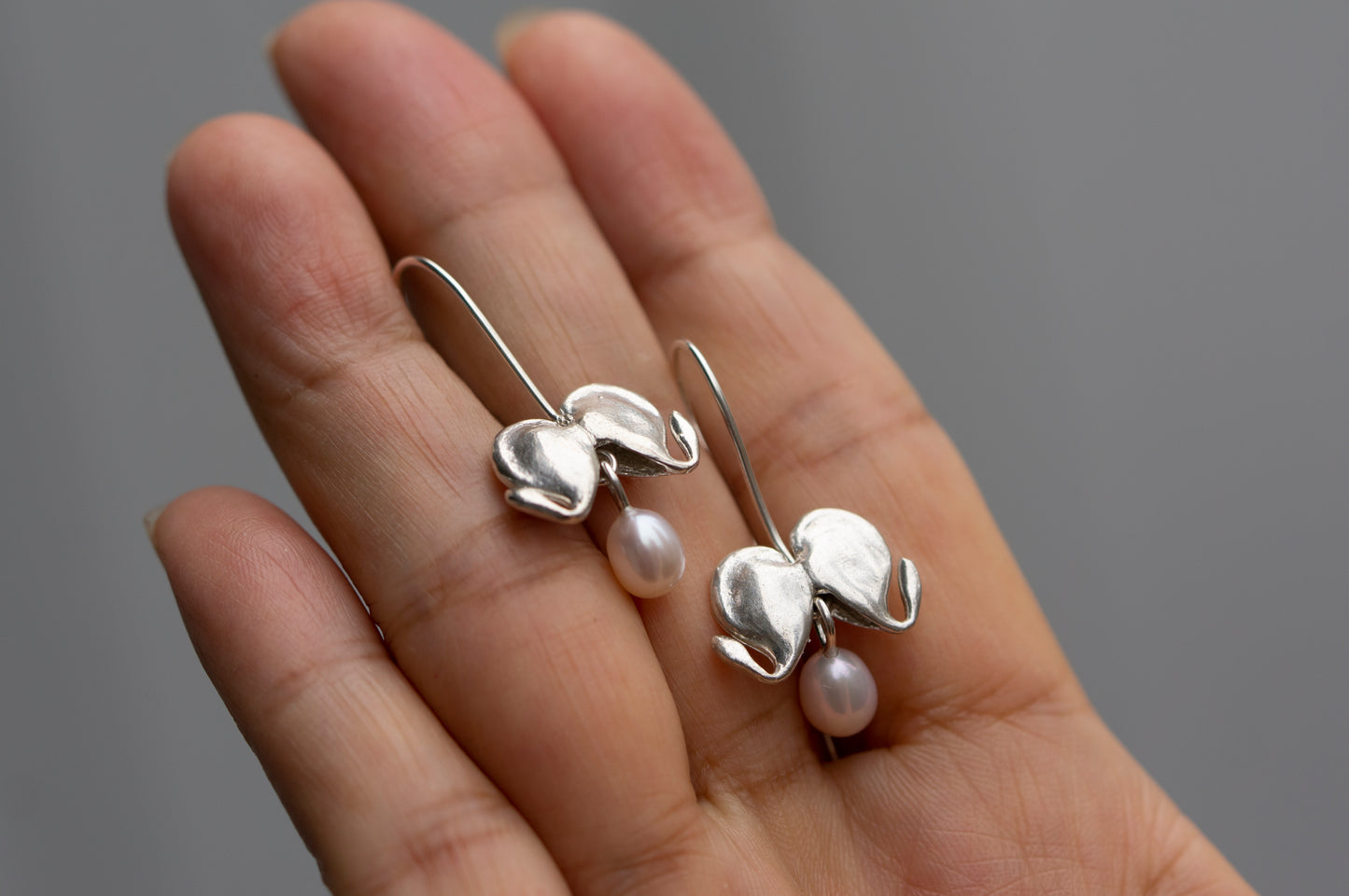 Bleeding heart silver dangle earrings