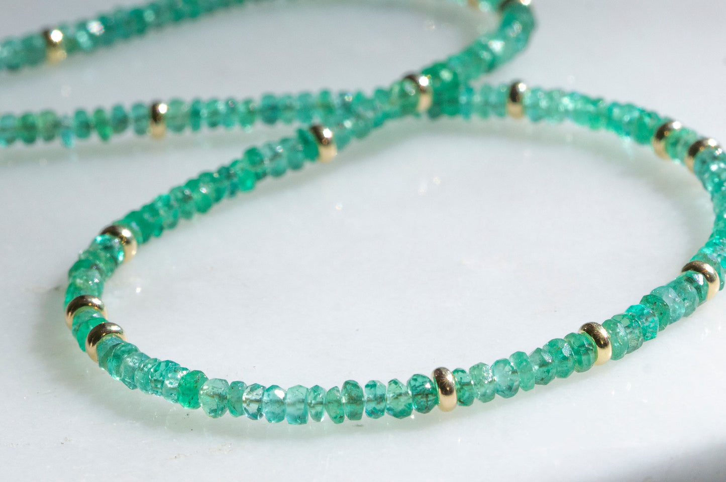 Emerald and gold bead necklace